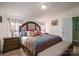 Comfortable main bedroom features a plush king bed, colorful decor, and ample closet space at 1762 Tomes Rd, Lincolnton, NC 28092