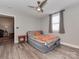 Bedroom with ceiling fan, gray walls, and a small nightstand at 210 Goff St, Charlotte, NC 28208