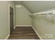 Walk-in closet has rod for hanging clothes and ample storage to keep you organized at 210 Goff St, Charlotte, NC 28208