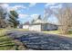 Exterior angle of the house featuring a large driveway and well-maintained landscaping at 214 E Main St, Cleveland, NC 27013