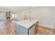 Open kitchen featuring an island with white countertop and stainless dishwasher at 214 E Main St, Cleveland, NC 27013