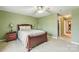 Calm green bedroom with a queen bed, bedside tables with lamps, and a ceiling fan at 2364 Nuthatch Dr, Rock Hill, SC 29732