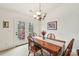 Cozy dining area featuring a wooden table set, chandelier lighting, and access to an outdoor patio at 2364 Nuthatch Dr, Rock Hill, SC 29732