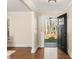 Open foyer featuring hardwood floors, neutral walls, and a peek into the home's front yard at 2401 High Ridge Rd, Charlotte, NC 28270