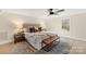 Spacious main bedroom featuring a decorative rug, a large bed, and modern furniture at 2401 High Ridge Rd, Charlotte, NC 28270