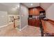 Bonus room with kitchenette, built-in shelves, and staircase at 25 Blenheim Ne Ct, Concord, NC 28025