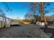 Large backyard with a deck and new fence, offering privacy and space for outdoor activities at 3004 Briarwood Ln, Gastonia, NC 28056