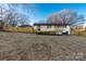 Expansive backyard with new wooden deck, fence, and covered parking at 3004 Briarwood Ln, Gastonia, NC 28056