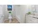 Clean bathroom with a white vanity, granite countertop, and a shower-tub combo at 3004 Briarwood Ln, Gastonia, NC 28056