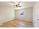 Simple bedroom with neutral walls, hardwood floors, and a ceiling fan at 3004 Briarwood Ln, Gastonia, NC 28056