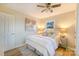 Cozy bedroom featuring wood floors, a ceiling fan, neutral paint, and a well-lit and inviting space at 3004 Briarwood Ln, Gastonia, NC 28056