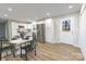 Open-concept kitchen featuring stainless steel appliances, modern countertops, and an adjacent dining area at 3004 Briarwood Ln, Gastonia, NC 28056