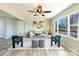 Bright living room featuring hardwood floors, a ceiling fan, and a large picture window at 3004 Briarwood Ln, Gastonia, NC 28056