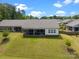 Large backyard with a screened porch, green lawn, and privacy fence at 315 Skyebrook Ln, Rock Hill, SC 29730