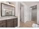 Modern bathroom features granite counters, dark wood cabinets, and a stylish framed mirror at 315 Skyebrook Ln, Rock Hill, SC 29730