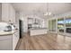 Modern kitchen featuring stainless steel appliances, an island with pendant lighting, and sliding glass doors to the patio at 315 Skyebrook Ln, Rock Hill, SC 29730