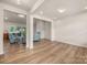 Open-concept living space featuring wood floors, recessed lighting, and a glimpse of a cozy seating area with a fireplace at 315 Skyebrook Ln, Rock Hill, SC 29730