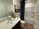 Well-lit bathroom features a shower-tub combo and modern fixtures at 326 Knotty Wood Dr # 66, Monroe, NC 28110