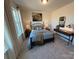 Cozy bedroom with a large window and comfortable bed at 326 Knotty Wood Dr # 66, Monroe, NC 28110