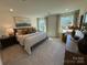 Inviting main bedroom with large windows and neutral tones at 326 Knotty Wood Dr # 66, Monroe, NC 28110