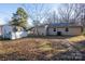 View of home's back, showcasing shed and yard space at 3721 Braden Dr, Charlotte, NC 28216
