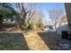 Backyard with shed and tree-lined hillside at 3721 Braden Dr, Charlotte, NC 28216