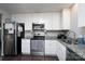 Kitchen with white cabinets, granite counters, and stainless steel appliances at 3721 Braden Dr, Charlotte, NC 28216