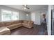 Living room with L-shaped sofa and hardwood floors at 3721 Braden Dr, Charlotte, NC 28216