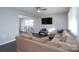 Spacious living room with L-shaped sofa and TV at 3721 Braden Dr, Charlotte, NC 28216