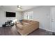 Living room with L-shaped sofa and hardwood floors at 3721 Braden Dr, Charlotte, NC 28216