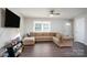 Living area with L-shaped sofa and hardwood floors at 3721 Braden Dr, Charlotte, NC 28216