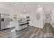 Well-lit kitchen featuring a large island, stainless steel appliances, and modern finishes at 404 Killian Ave, Mount Holly, NC 28120