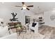 Open-concept living area featuring modern decor, leading into a stylish, white kitchen at 404 Killian Ave, Mount Holly, NC 28120