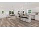 Spacious living area with modern open layout flowing into the kitchen and dining area at 404 Killian Ave, Mount Holly, NC 28120