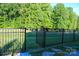 Fenced backyard with lush greenery offering privacy and security, perfect for outdoor activities and enjoyment at 4194 La Crema Dr, Charlotte, NC 28214