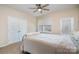 Cozy bedroom features a queen bed, a window view, and a large closet at 4194 La Crema Dr, Charlotte, NC 28214