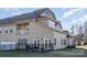 Back exterior view of home featuring the patio, deck and well-manicured lawn at 4194 La Crema Dr, Charlotte, NC 28214