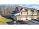 Beautiful two-story townhome with a stone facade, two-car garage, and manicured landscaping at 4194 La Crema Dr, Charlotte, NC 28214
