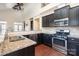 Stylish kitchen featuring granite countertops, stainless steel appliances, and ample cabinet space at 4194 La Crema Dr, Charlotte, NC 28214