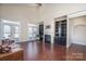 Spacious living room with a fireplace, built-in shelving, and access to the balcony at 4194 La Crema Dr, Charlotte, NC 28214