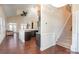 Bright living room with hardwood floors, modern kitchen, staircase and plenty of natural light at 4194 La Crema Dr, Charlotte, NC 28214