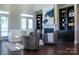 Bright living room with fireplace, built-in bookshelves, and a comfortable sofa for relaxation and entertainment at 4194 La Crema Dr, Charlotte, NC 28214