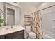 Cozy bathroom featuring a shower-tub, storage shelving, and a modern vanity with sink at 4929 Norman Park Pl, Clover, SC 29710