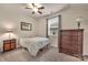 Bedroom with a cozy bed, ample natural light from the window, and a wooden dresser at 4929 Norman Park Pl, Clover, SC 29710