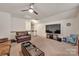 Upstairs bonus room with a TV, ceiling fan, and comfortable leather seating at 4929 Norman Park Pl, Clover, SC 29710