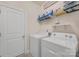 Functional laundry room with appliances, overhead storage, and a utility sink at 4929 Norman Park Pl, Clover, SC 29710