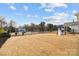 Spacious backyard with a black metal fence, playground and swing set at 5024 Hillshire Ln, Mint Hill, NC 28227