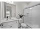 Clean and modern bathroom with white fixtures and a glass-enclosed shower at 5024 Hillshire Ln, Mint Hill, NC 28227