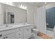 Bathroom with double vanity, white cabinets, blue tile backsplash, and shower with a white curtain at 5024 Hillshire Ln, Mint Hill, NC 28227