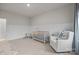 Neutral Bedroom with a comfortable chair, baby crib, chair rail, and neutral tones at 5024 Hillshire Ln, Mint Hill, NC 28227